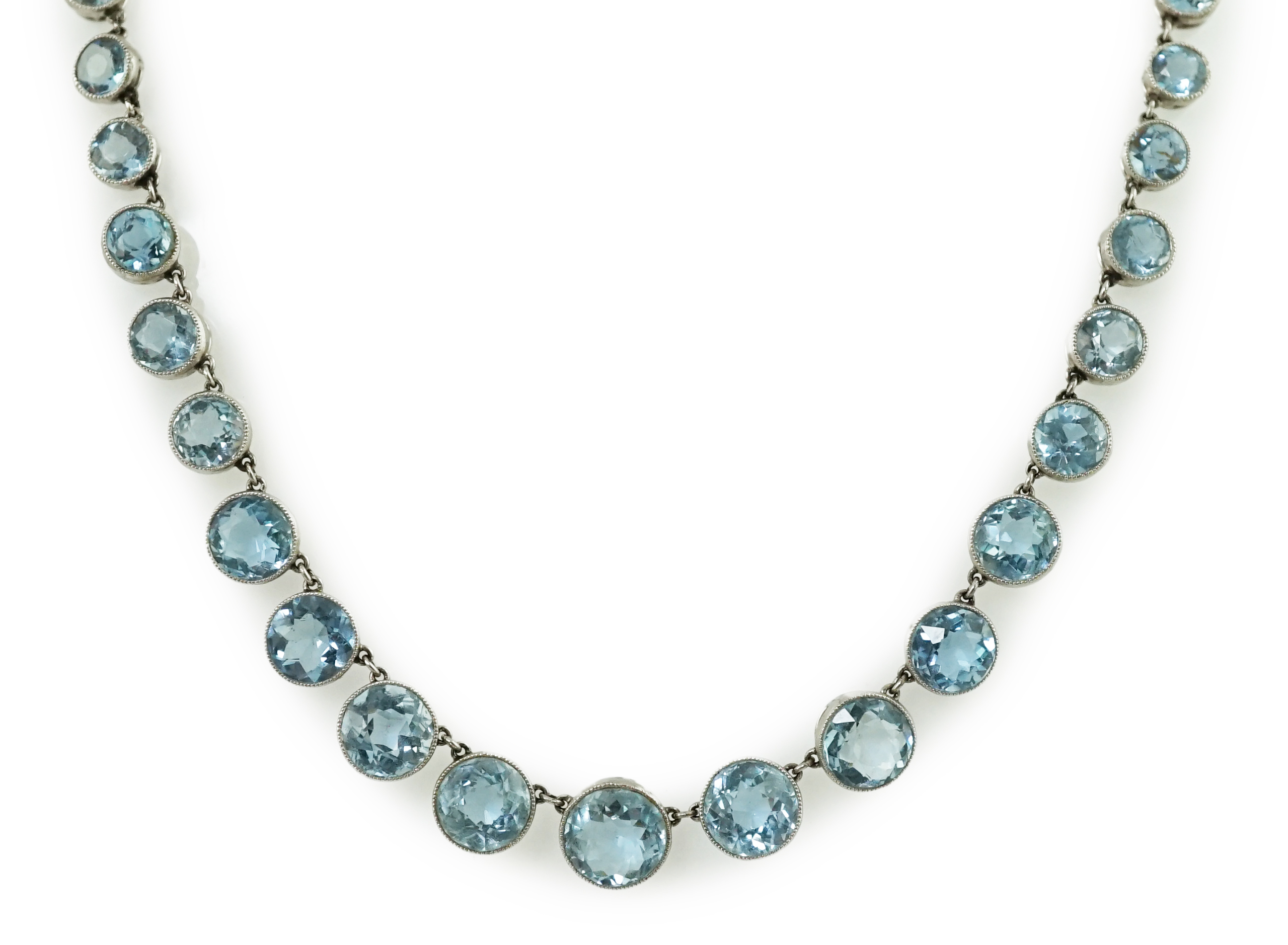 A Belle Epoque platinum and millegrain set graduated aquamarine necklace